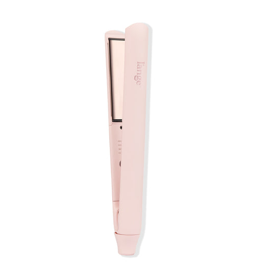 The blush-colored Straight Forward Titanium Flat Iron stands in a white background with a titanium plate showing.